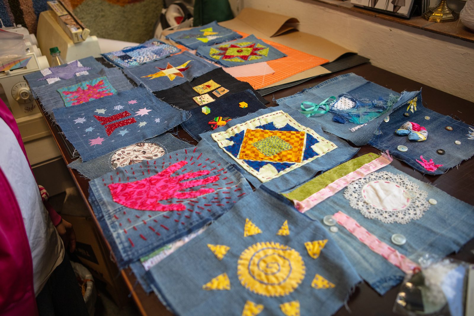 An overhead view of finished quilt blocks laid out together.