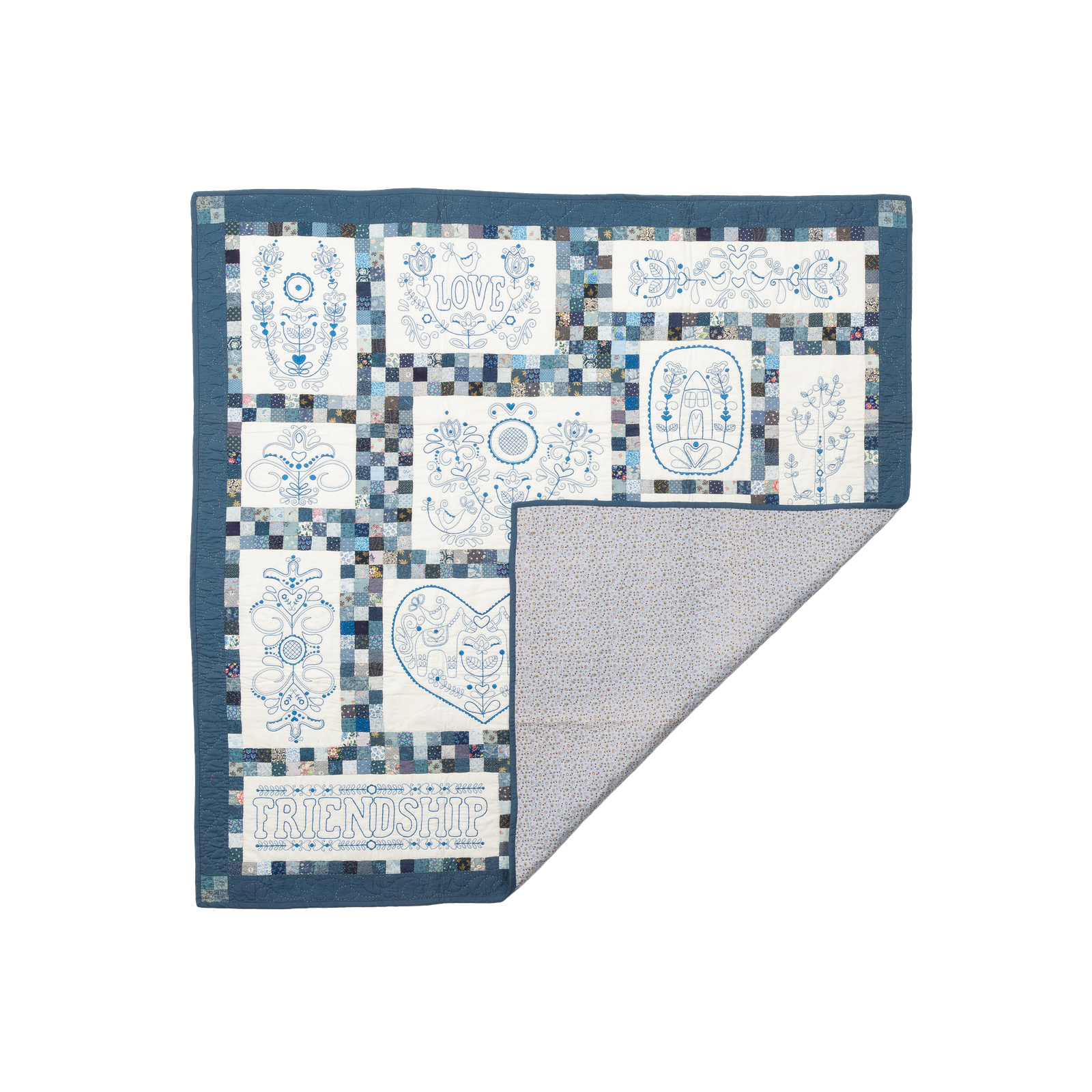 Scandinavian Rose, a quilt with embroidered LOVE and FRIENDSHIP text panels.